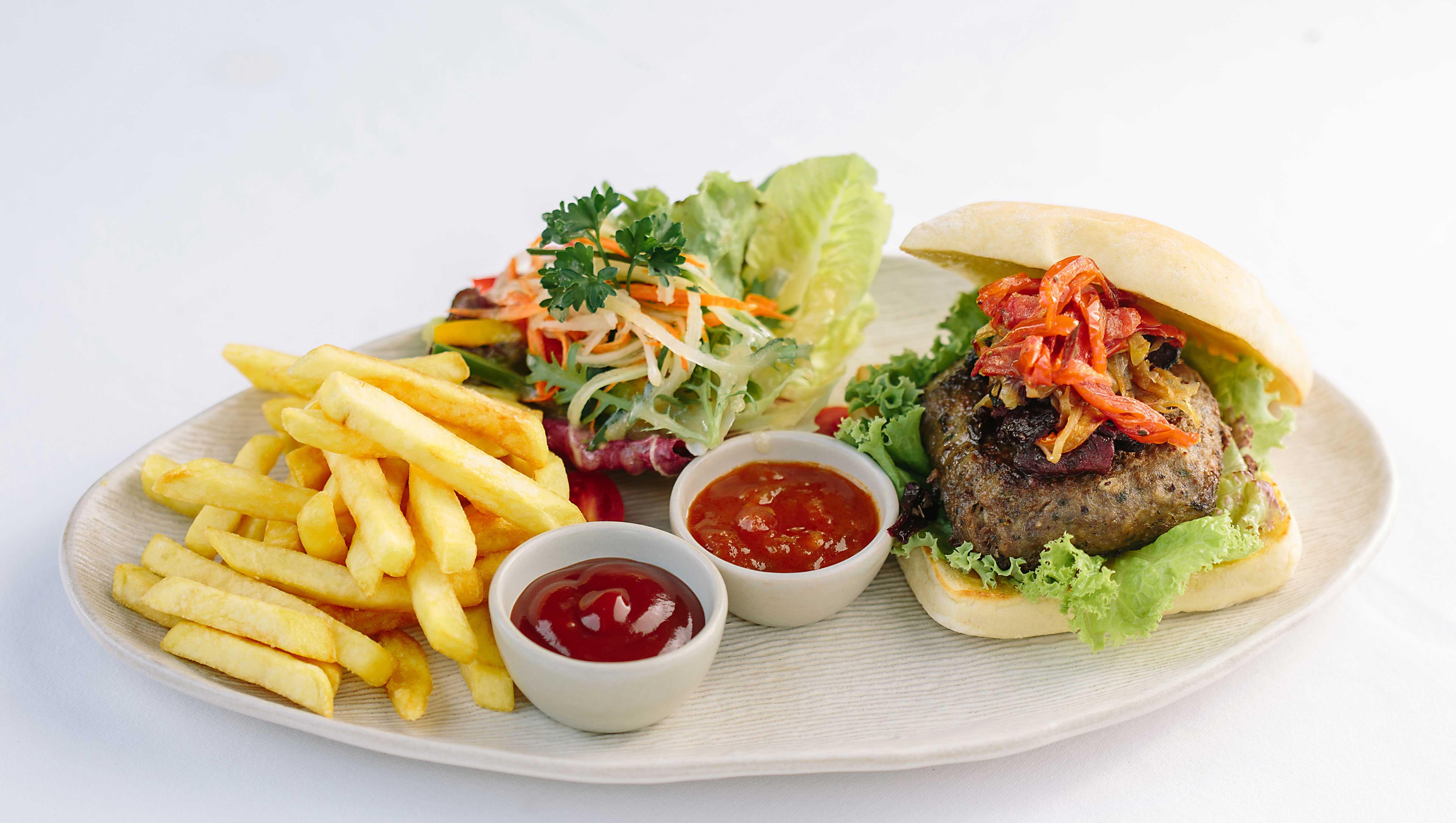Tejaprana Resort y Spa Ubud Exterior foto A hamburger with chips and salad
